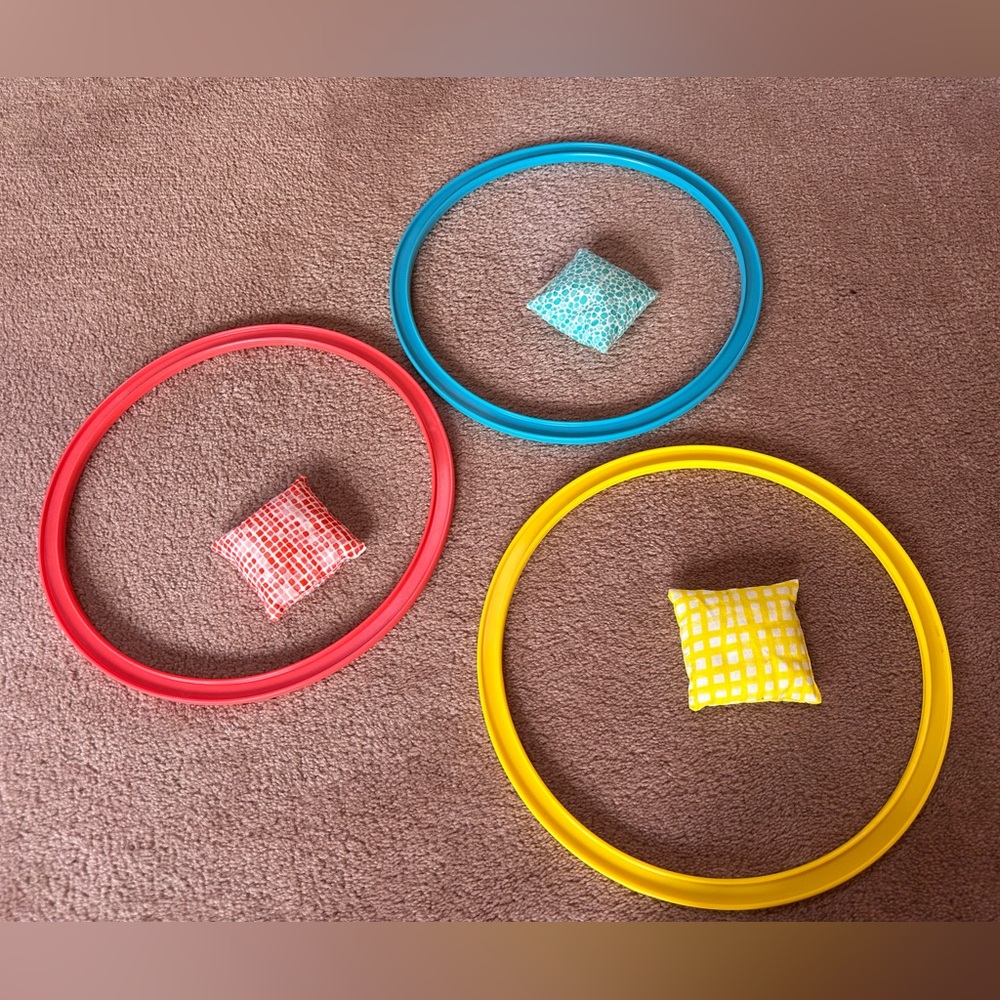 Lovevery Colorful Ring Toss and beakers Set